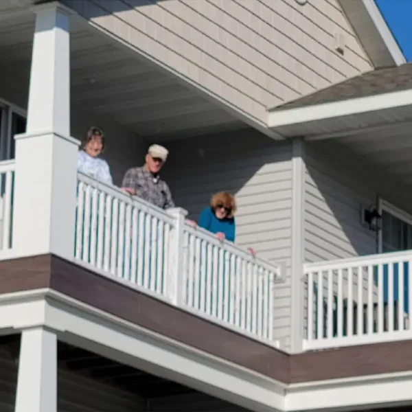 Illinois Presbyterian Home Communities - Fair Hills Tower residents looking out over balcony - Springfield IL